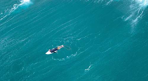velzyland beach aerial photography of man surfing haleiwa